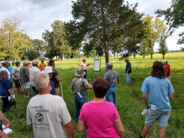 people listening to instruction at grazing workshop