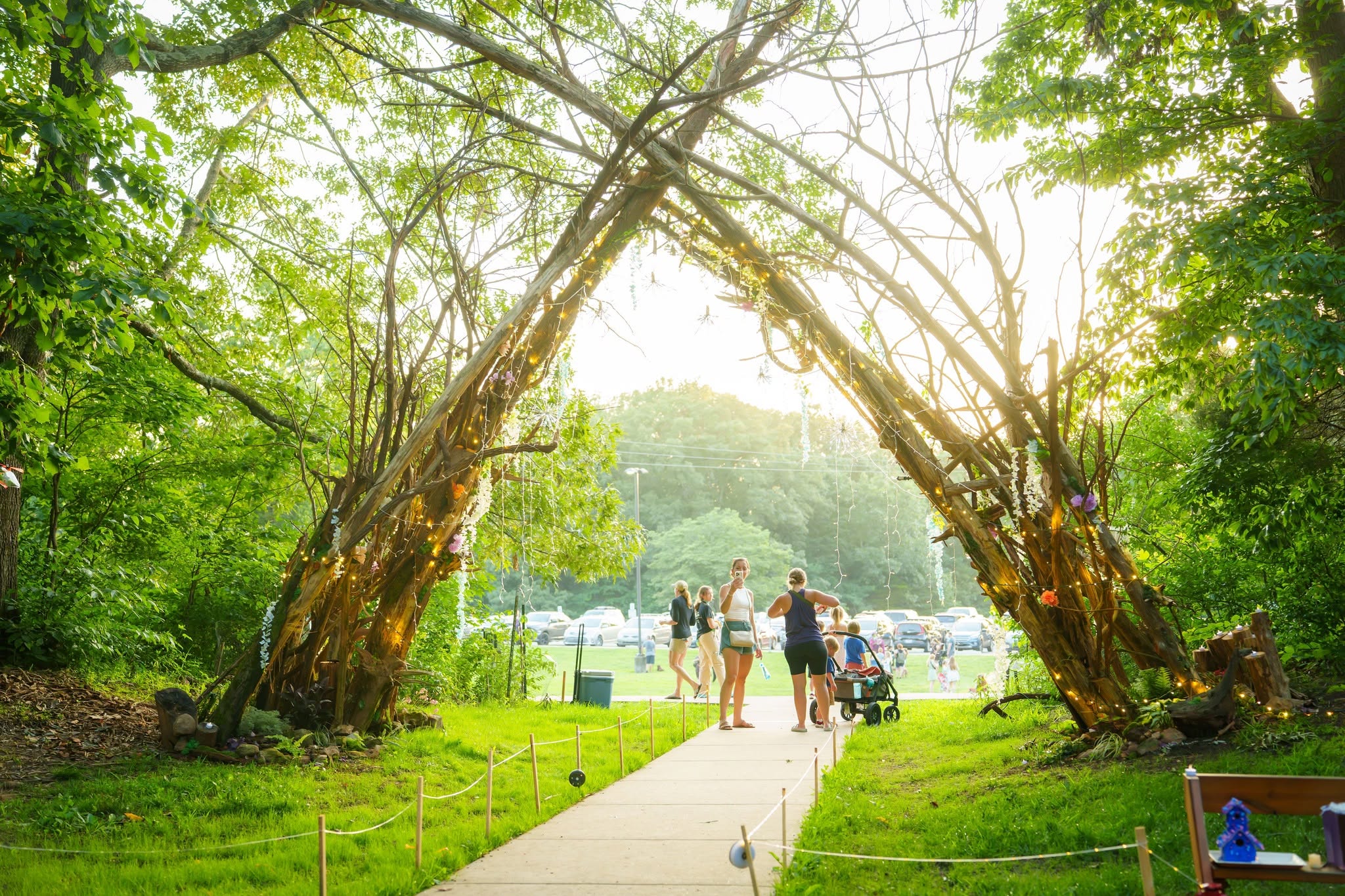 People walking along a wooded trail
